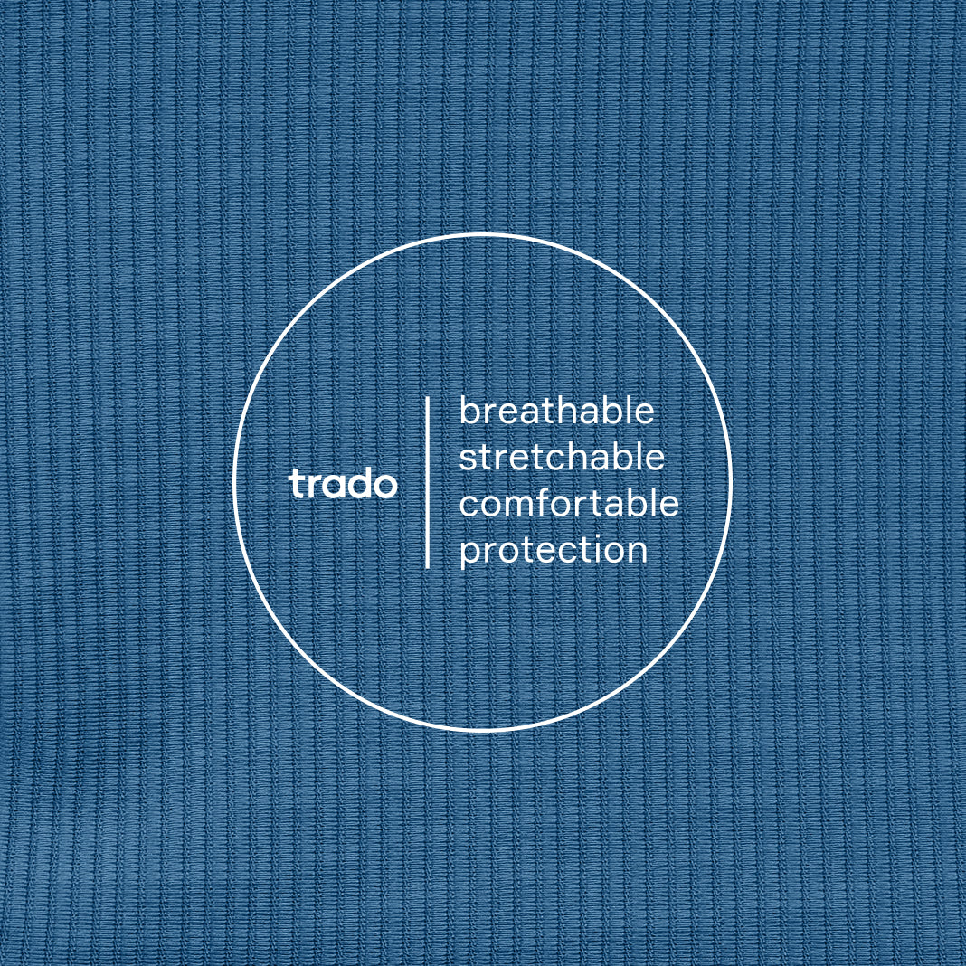 Text 'trado breathable stretchable comfortable protection' on a blue textured background