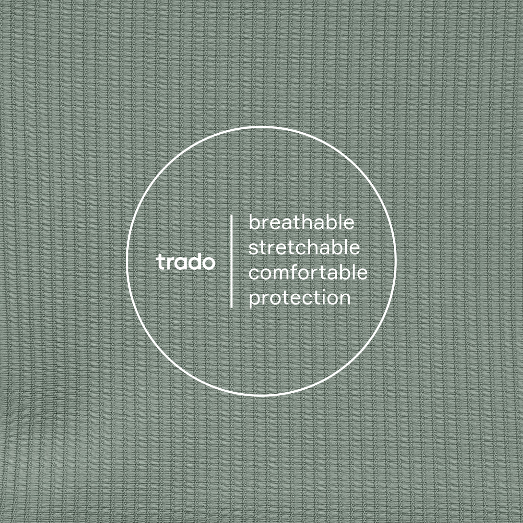 Text 'trado' with descriptors 'breathable', 'stretchable', 'comfortable', 'protection' on a textured dusty green background