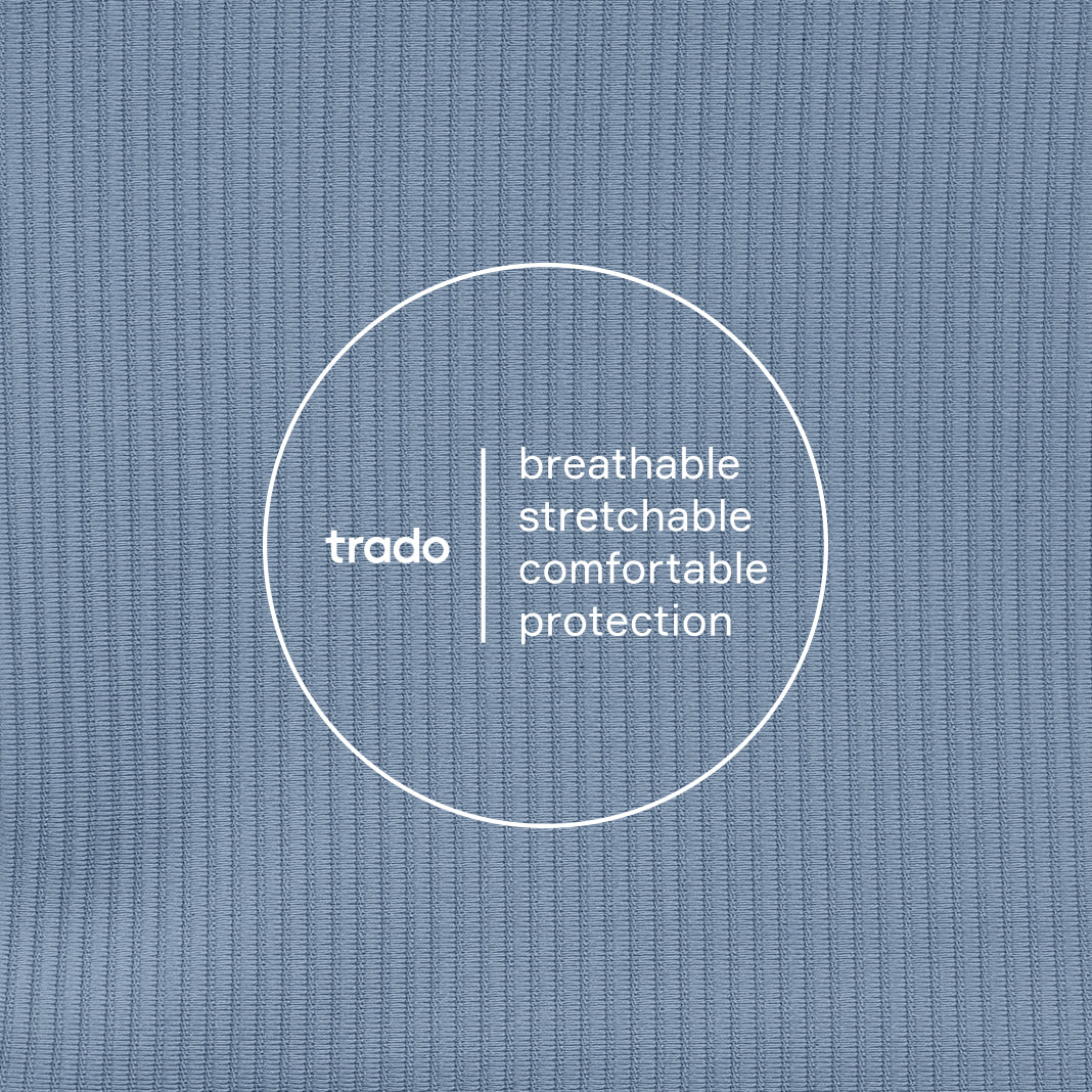 Text ' breathable stretchable comfortable protection' with 'trado' logo on a textured baby blue background